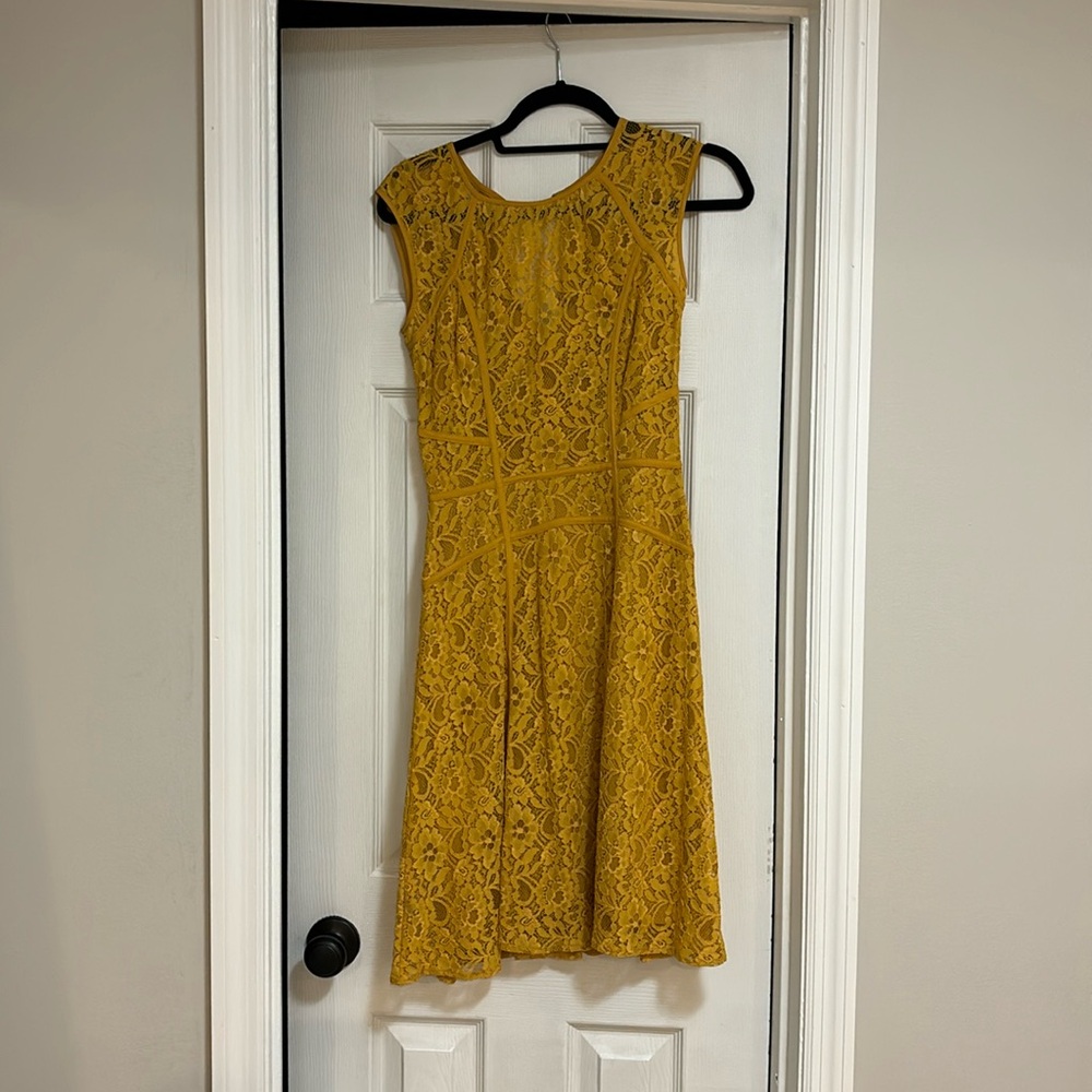 Yellow BCBG Max Azria lace dress. Size xxs but fits like small. Has stretch.